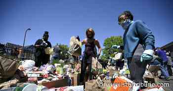 In midst of chaos, Minneapolis residents turn out in force to mop up, put out fires