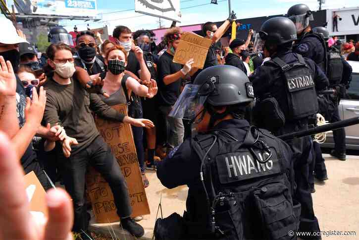 Protests over police killings rage in dozens of US cities
