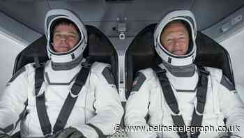 Nasa astronauts arrive at space station after 19-hour journey