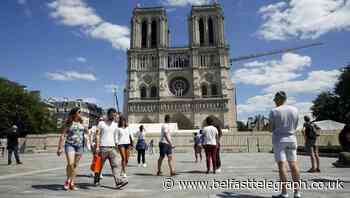 Notre Dame forecourt opens to public a year after blaze damaged cathedral