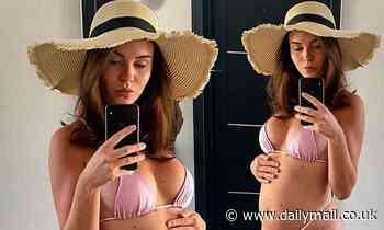 Shelby Tribble cradles her baby bump while wearing a bikini and jokes she is 'trying to be a MILF'