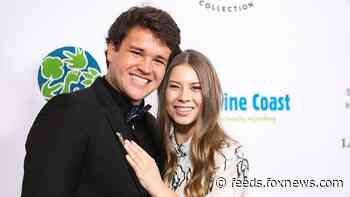 Bindi Irwin and husband Chandler Powell explain how their honeymoon has been 'slightly crazy'