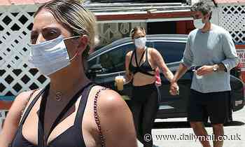 Lady Gaga masks up and holds hands with boyfriend Michael Polanksy during coffee run in Los Angeles