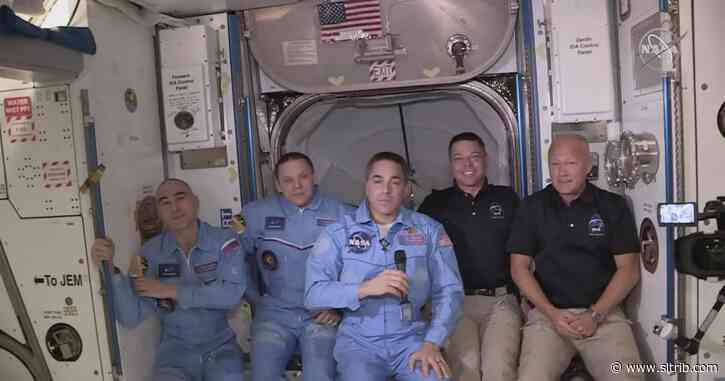 NASA astronauts arrive at space station after historic launch