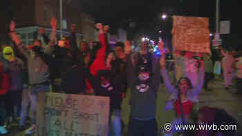 Niagara Falls Mayor, several law enforcement officers kneel alongside protesters