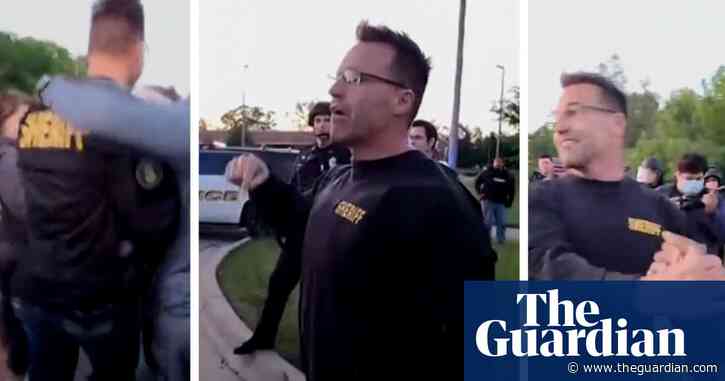 'These cops love you': Michigan sheriff joins George Floyd protesters in Flint – video