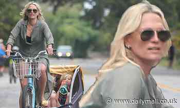 Molly Sims looks like she has her hands full as she takes her three kids to the beach