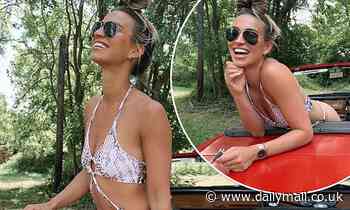Ferne McCann flaunts her sensational frame as she larks around in a convertible car