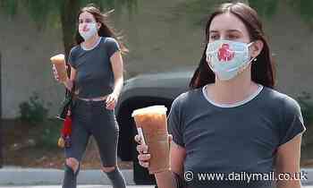 Demi Moore's daughter Scout Willis wears a fun floral mask while showing off her impressive figure