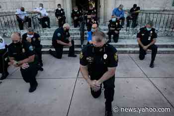 Officers kneel in solidarity with protesters in several cities