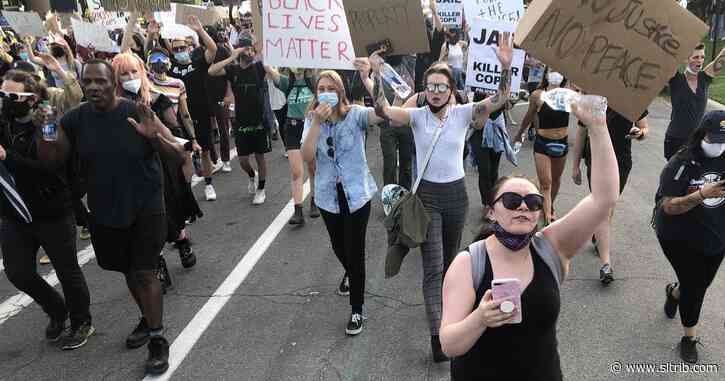 Peaceful protesters march to police headquarters as officers take a knee; SLC mayor announces new one-week curfew