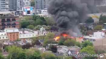 Three-alarm fire tears through row house in Toronto