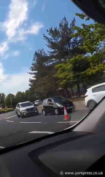 WATCH: Dozens of cars queue for McDonald's drive-thru reopening