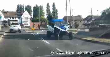 Moment buggy driver almost loses it after accelerating at roundabout