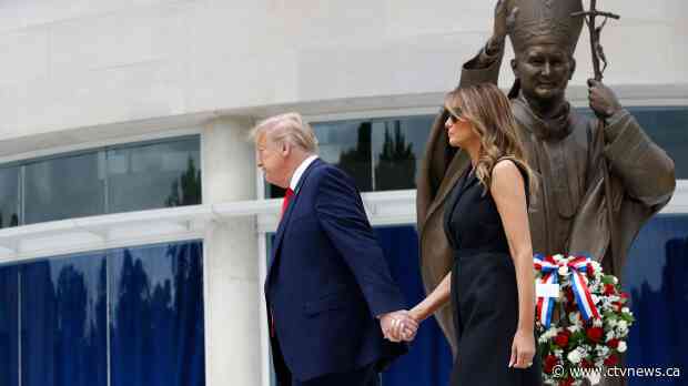 Embracing religious themes, Trump visits John Paul II shrine