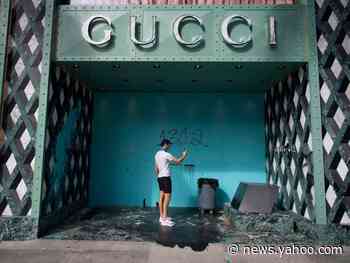 Shattered storefronts and 'eat the rich' graffiti: Photos show the aftermath of destruction in luxury stores that were looted and vandalized during the protests