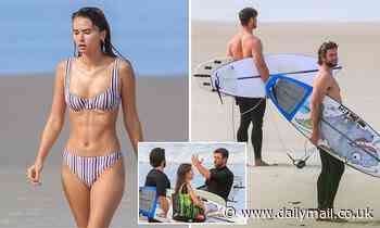 Chris and Liam Hemsworth hit the beach in Byron Bay with bikini-clad model Gabriella Brooks - Daily Mail