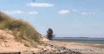 Watch the moment bomb disposal experts blew up suspect items on a beach