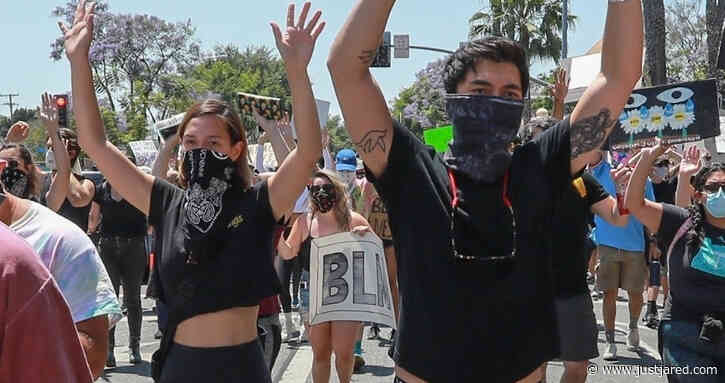 Henry Golding & Wife Liv Lo Walk with Their Hands Up During Black Lives Matter Protest