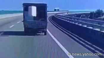 Box truck drops box, box jumps back into truck — twice