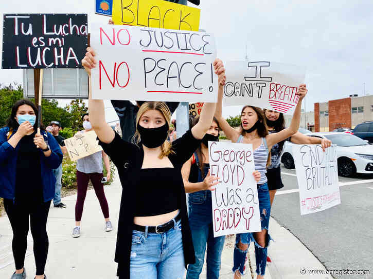 Protesters gather near The Outlets at Orange to oppose George Floyd’s death