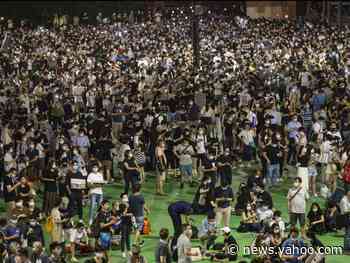 Photos show thousands of Hong Kongers defying a police order to attend vigils memorializing the victims of the Tienanmen Square massacre