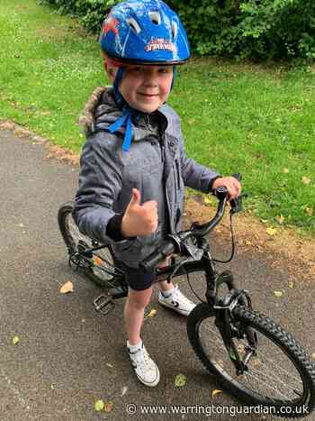 6-year-old gets on bike in pouring rain to raise money for Chester Zoo