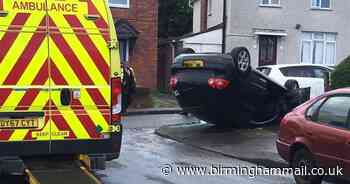 Two taken to hospital after VW Golf flips on to roof in Dudley