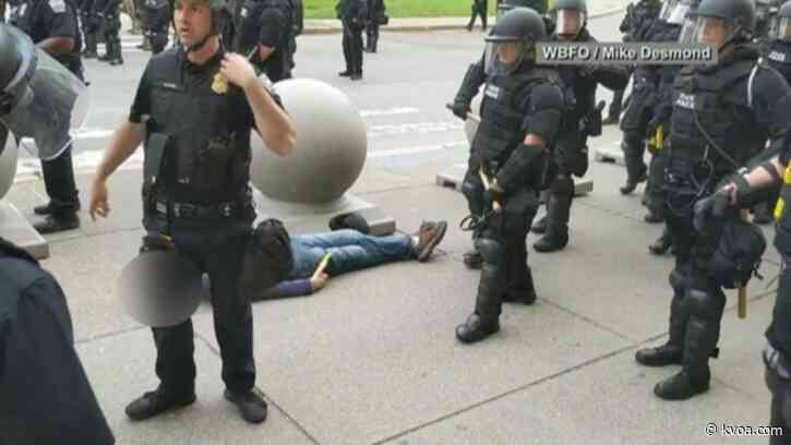 Officers suspended after man, 75, shoved and hurt on video