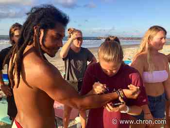 Texas surfers paddle out for George Floyd to honor of victims of racial injustice