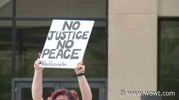 Omaha protests: Crowd marches from Memorial Park; medical professionals take a knee - WOWT