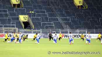 Top two win in Germany as players take a stand against racism