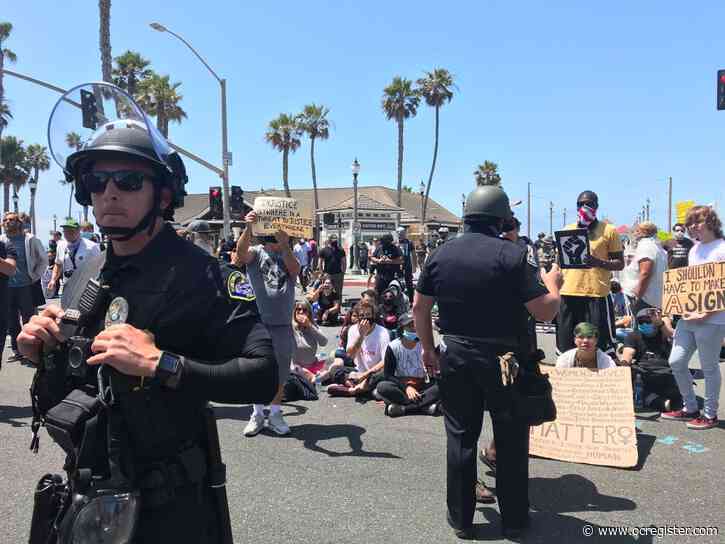 Crowd protesting police brutality met by counter-protesters near Huntington Beach pier