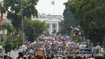 Protesters pour into Washington DC for city’s largest demonstration yet