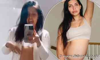Pregnant Cara De La Hoyde displays her bump in a white crop top