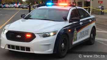 Woman charged after body found in Saskatoon parking lot