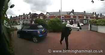 Watch: Brazen thug hurls brick at family home