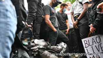 Protesters pull down statue of slave trader and push it into harbour