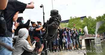 Protesters pull down statue of slave trader and push it into harbour