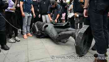 Police investigate after protesters pull down statue of slave trader