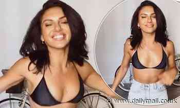 Alexandra Cane shows off her ripped physique as she dances in a TINY black bra and denim hot pants