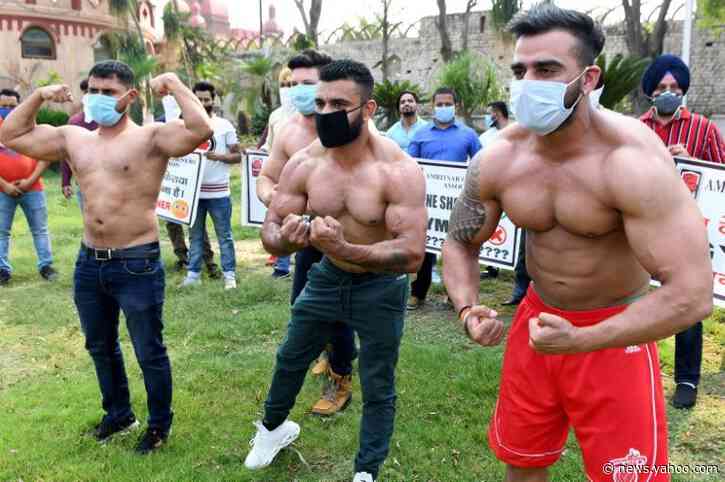 India's bodybuilders flex muscles, call for gyms to open