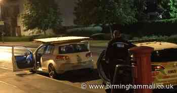 Car stopped after men seen 'stealing fence and putting on roof'