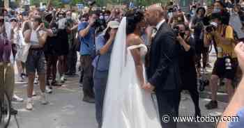 Newlyweds join Philadelphia protest on their wedding day: 'The power of love'