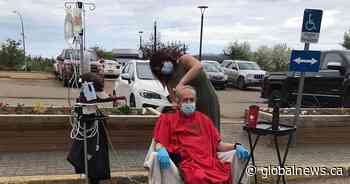 Fort McMurray strangers brought together by parking lot haircut amid COVID-19