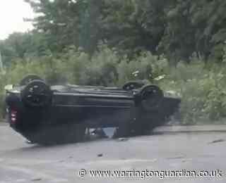 Driver arrested after car overturns in crash on Winwick Road