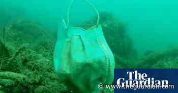 'Covid waste': disposable masks and latex gloves turn up on seabed – video