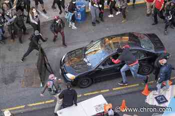 Armed driver barrels toward Seattle protesters, shooting one before surrendering to police