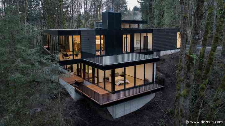 Black wood and glass volumes stagger down Oregon woodland to form Royal house