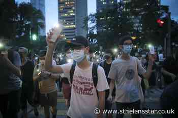 Hundreds march in Hong Kong as leader urges stability - St Helens Star